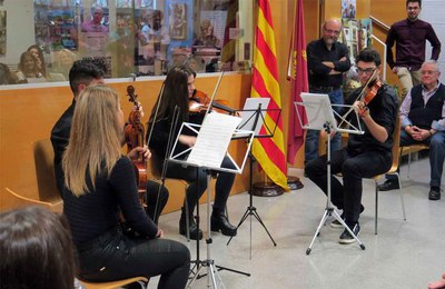 Un quartet de violí de l'Orfeó Lleidatà ha posat el toc musical a l'acte.